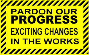 Construction message that says pardon our progress exciting changes in the works.