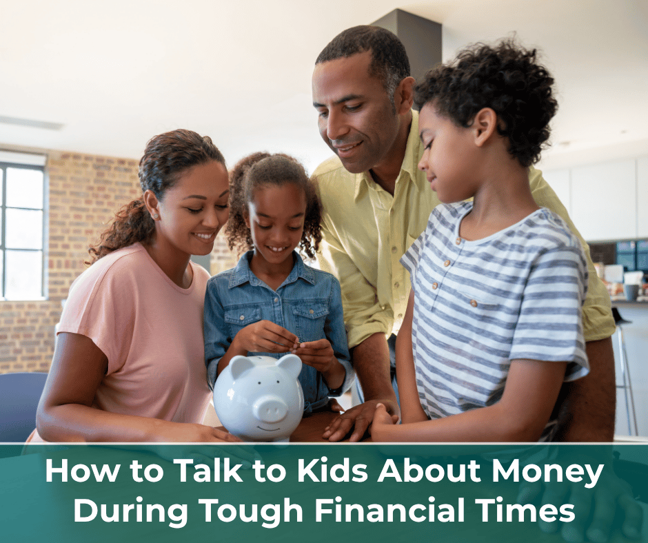 Family gathered at table with young girl putting money into a piggy bank.