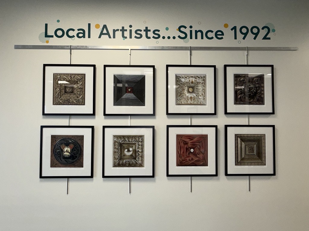 Image of Jeannie's artwork on display in IAACU lobby.